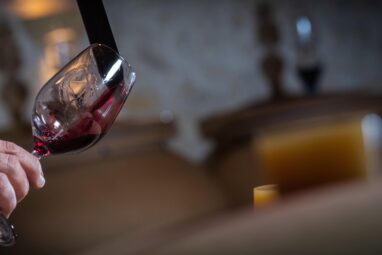 FRANCE, GIRONDE, SAINT-EMILION, SAMPLING A GLASS OF WINE IN A BARREL WITH A PIPETTE FOR TASTING AND VINIFICATION MONITORING, HIGHT QUALITY PHOTO